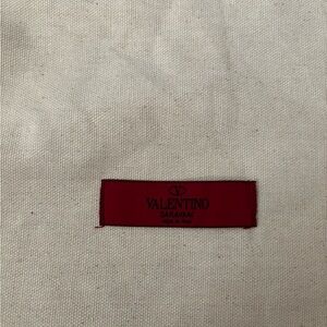Valentino Garavani Red Label on Cream Fabric